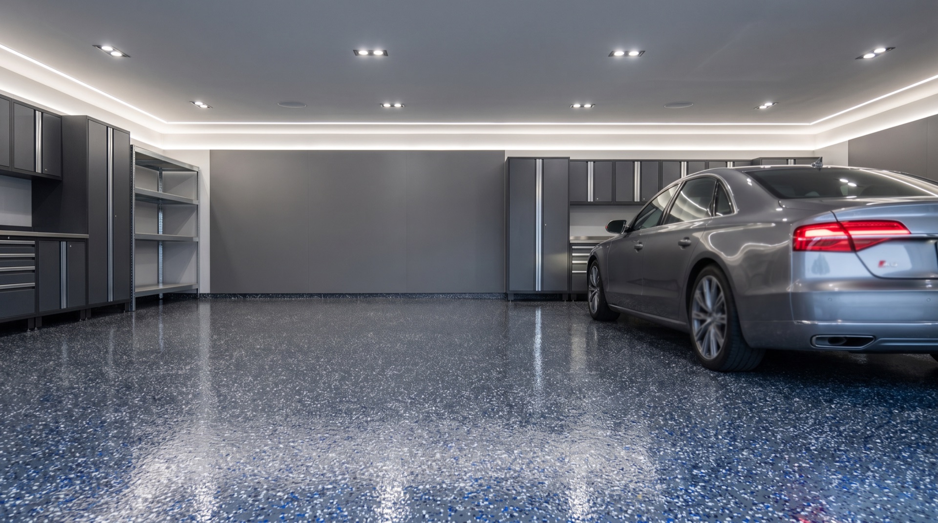 Freshly coated grey flake garage floor in a Jacksonville home with a high-gloss finish